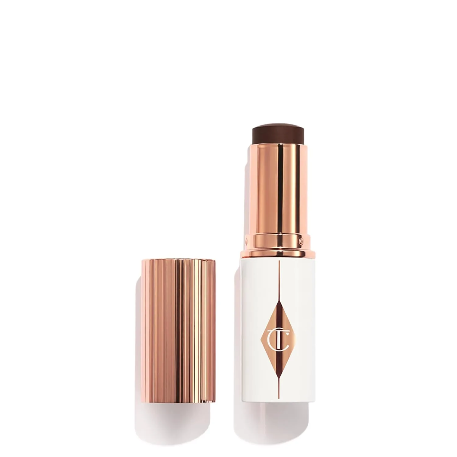 Charlotte Tilbury Unreal Skin Tint & Sheer Glow Hydrating Foundation Stick - тональная основа с увлажняющим эффектом и легким покрытием, 17 Deep - Deepest with neutral undertones