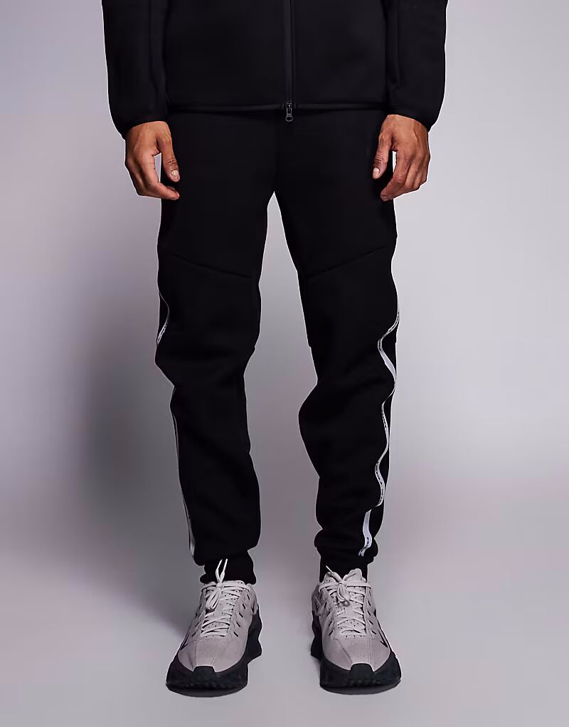 Светоотражающие спортивные брюки Tech Fleece черного цвета Nike — фото 2