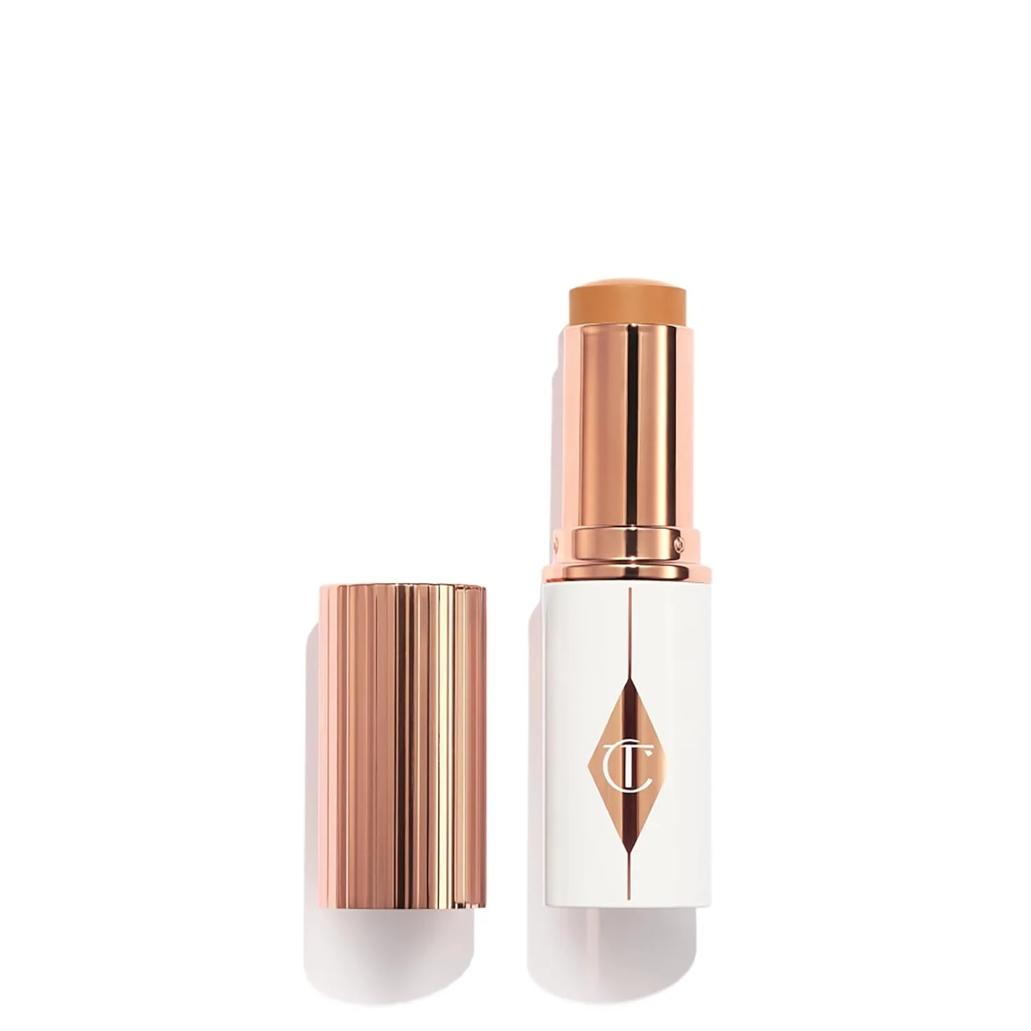 Charlotte Tilbury Unreal Skin Tint & Sheer Glow Hydrating Foundation Stick - тональная основа с увлажняющим эффектом и легким покрытием, 10 Tan - Tan with warm undertones