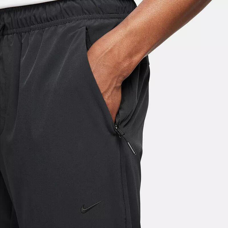 Мужские универсальные зауженные брюки Nike Dri-FIT Unlimited, черный — фото 4