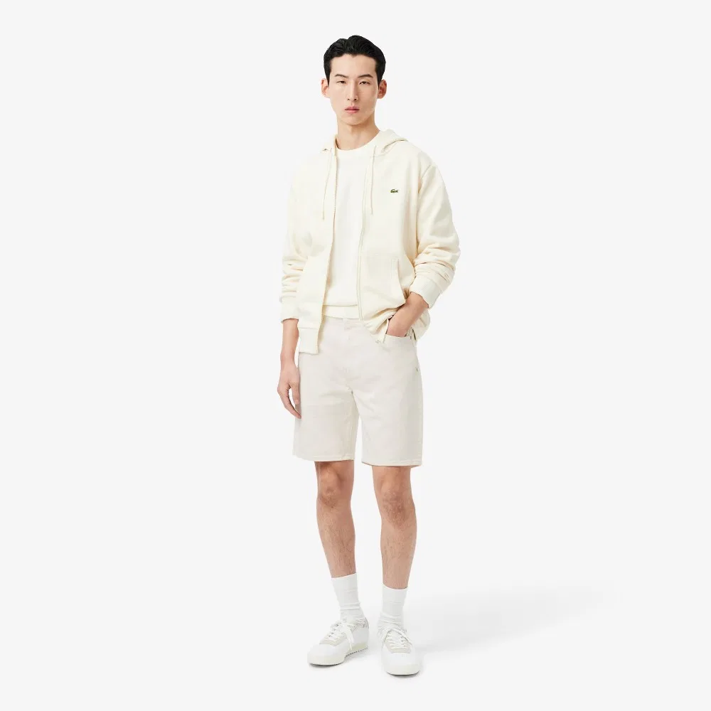 Мужские джинсовые шорты бермуды молочного цвета от Lacoste