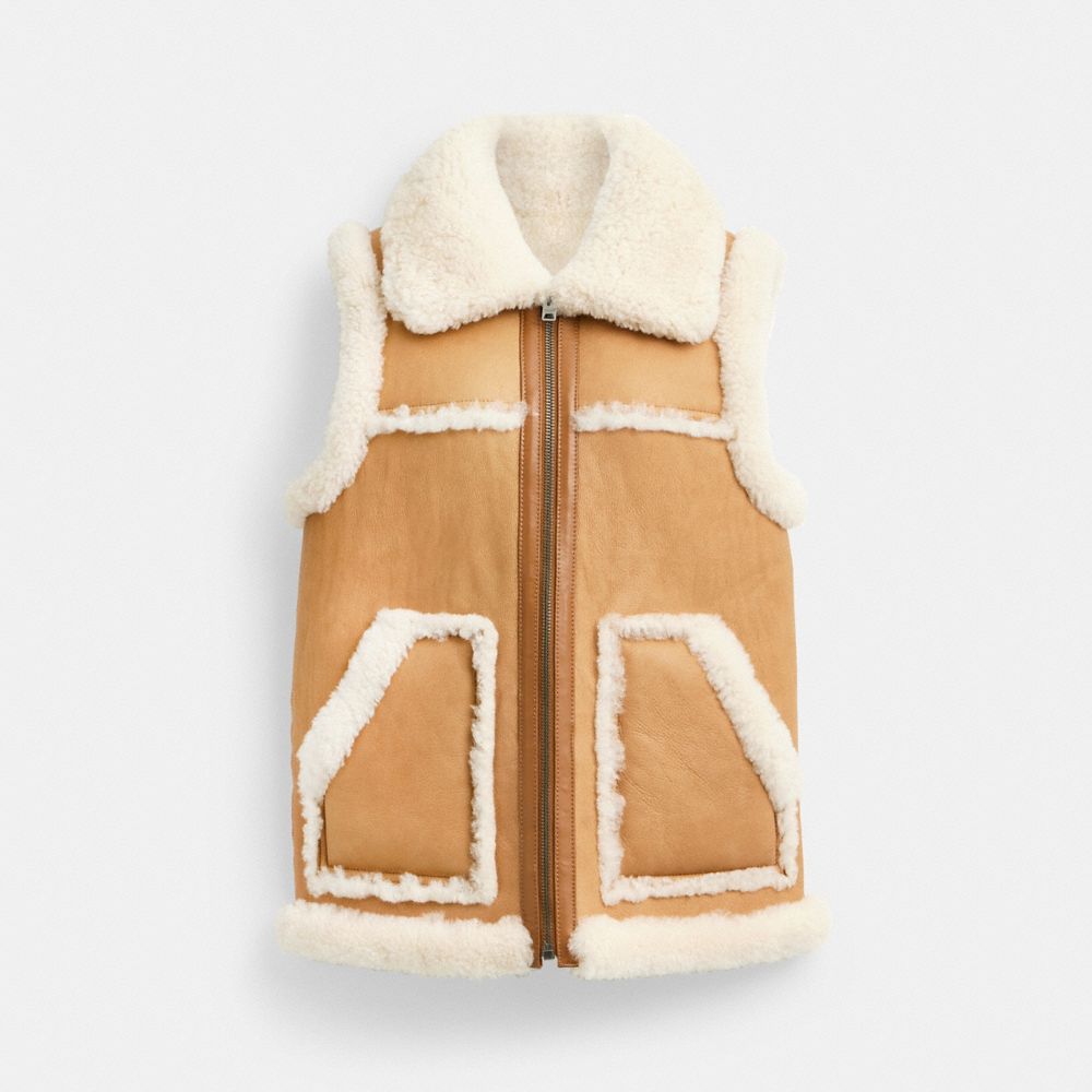

Жилет Coach Reversible Shearling Vest, цвет Natural/Ivory