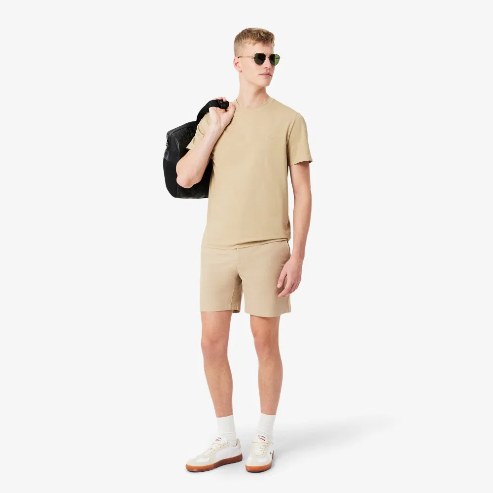Мужские эластичные шорты-бермуды из полиэстера бежевые от Lacoste — фото 4