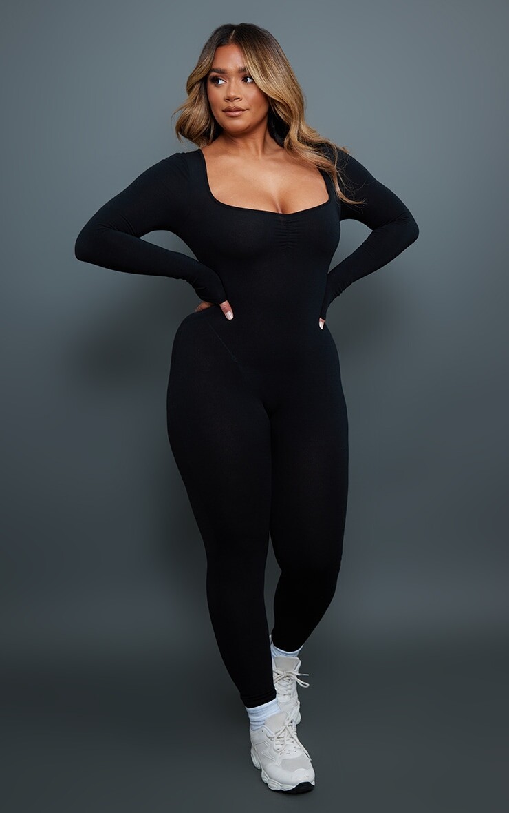 

PrettyLittleThing Черный комбинезон из джерси с длинными рукавами и рюшами и бюстом