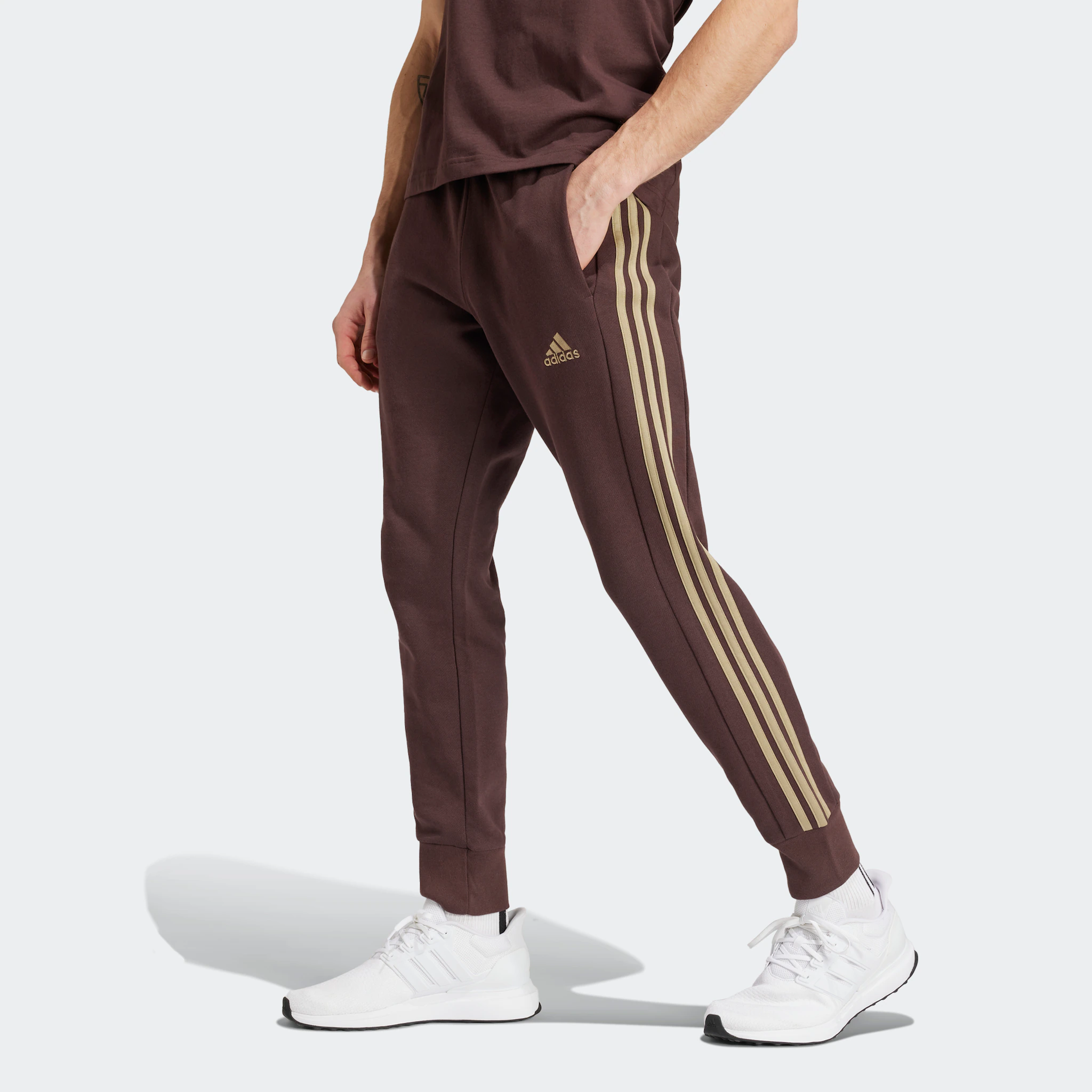 

Adidas Sportswear спортивные брюки "ESSENTIALS FRENCH TERRY TAPERED CUFF 3-STRIPES PANTS" (1 шт.), цвет Shadow Brown