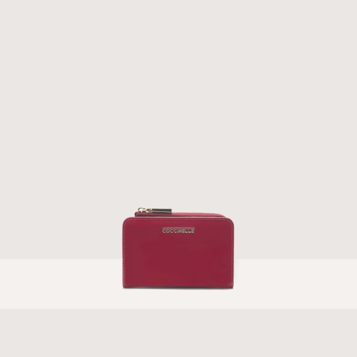

Кошелек Coccinelle Metallic Patent, цвет Sangria
