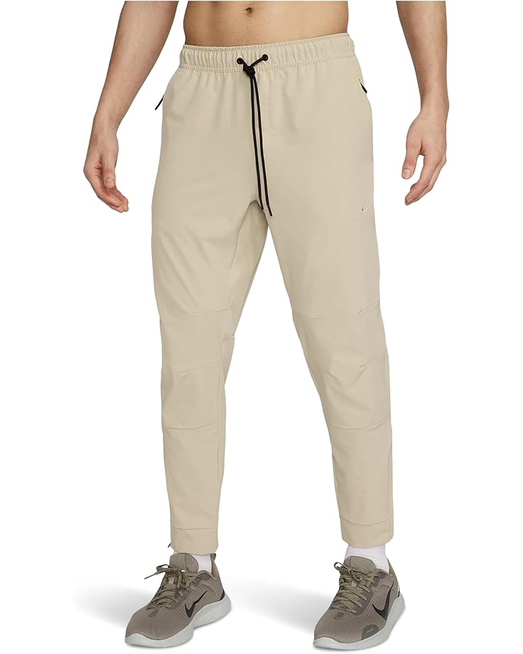 

Брюки Nike Dri-FIT Unlimited Tapered Pants, цвет Desert Khaki/Black/Desert Khaki