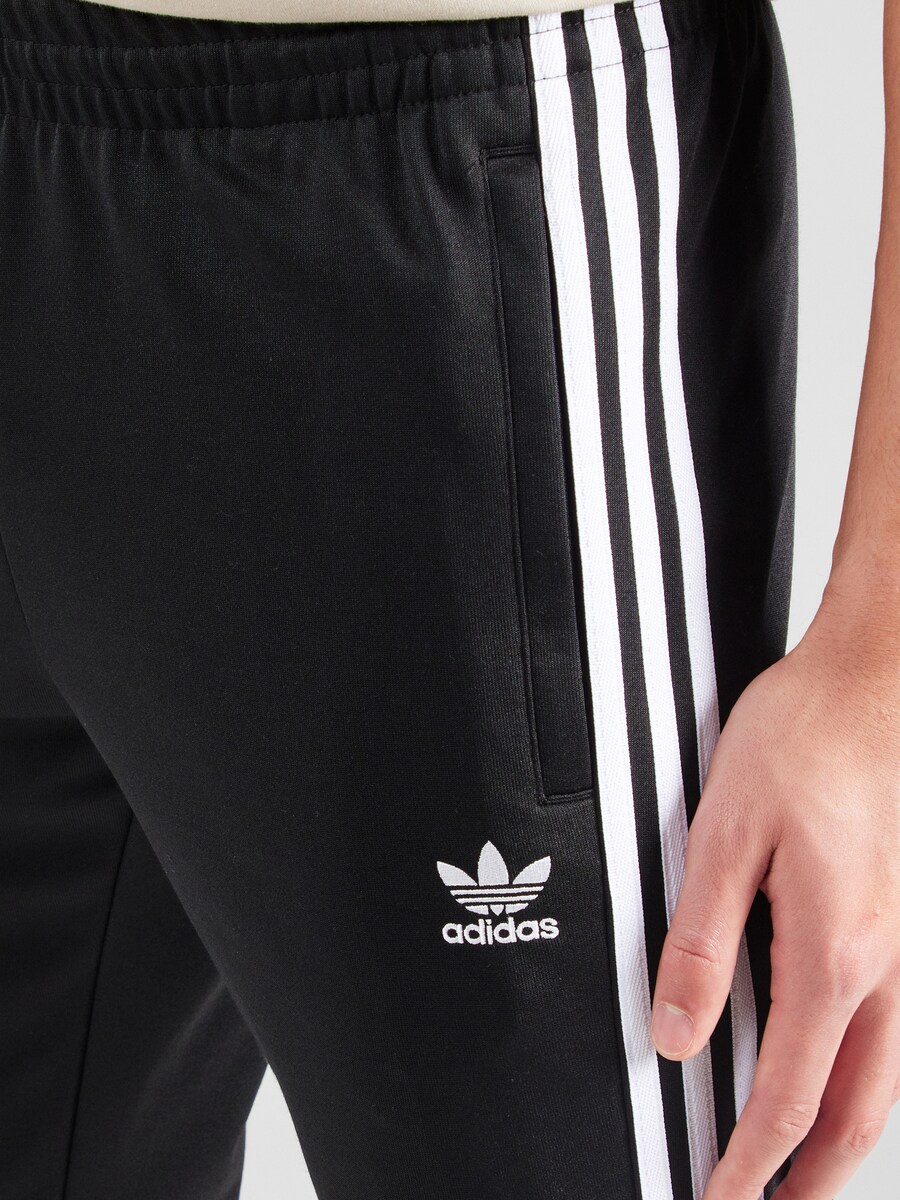 Зауженные тренировочные брюки ADIDAS ORIGINALS Adicolor Classics SST, черный — фото 4