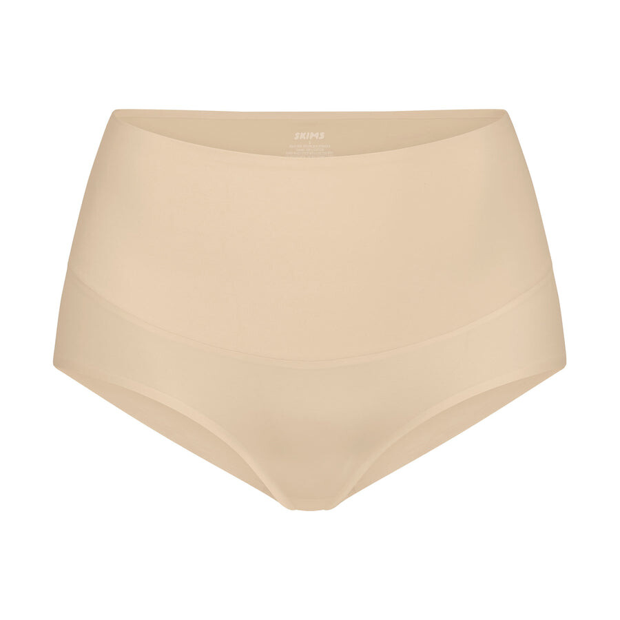 

Трусики с высокой талией SKIMS Smoothing Intimates, песочный