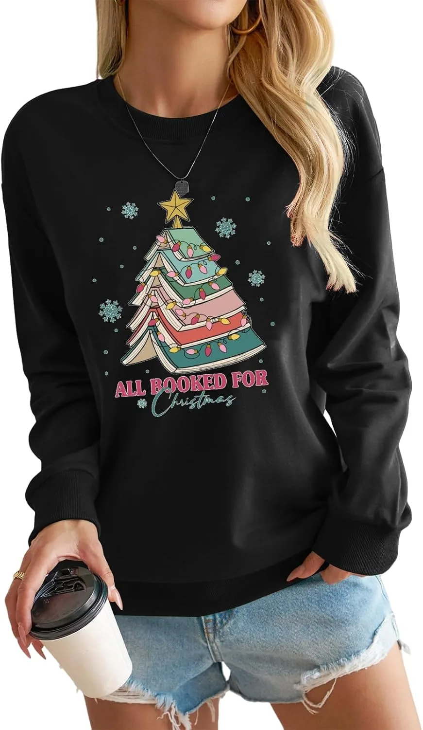 

Женский свитер All Booked for Christmas с принтом в виде книг и ёлки KVOTUU