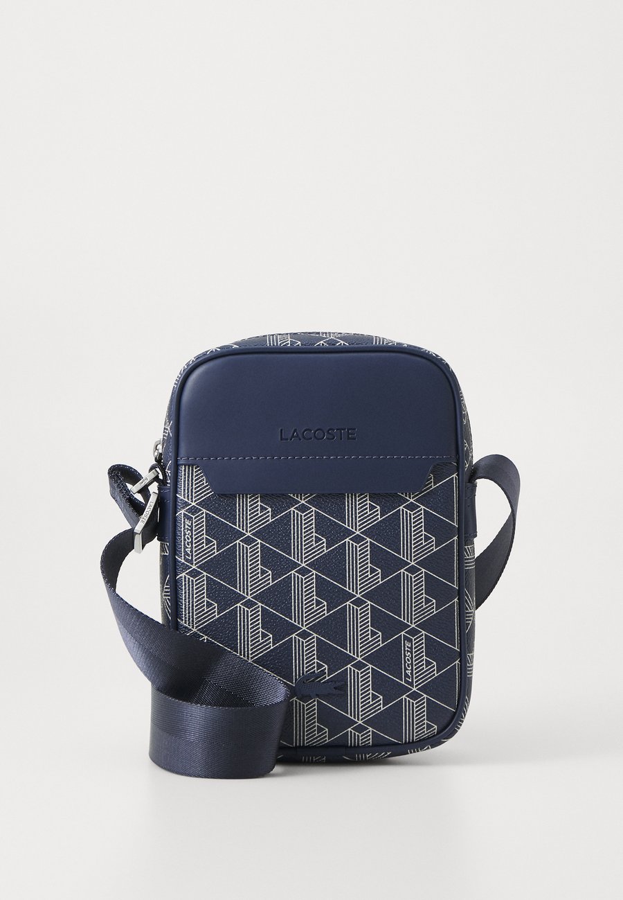 

Сумка кросс-боди Lacoste VERTICAL CAMERA BAG UNISEX, Mono Marine 166 Laponie/Dark Blue