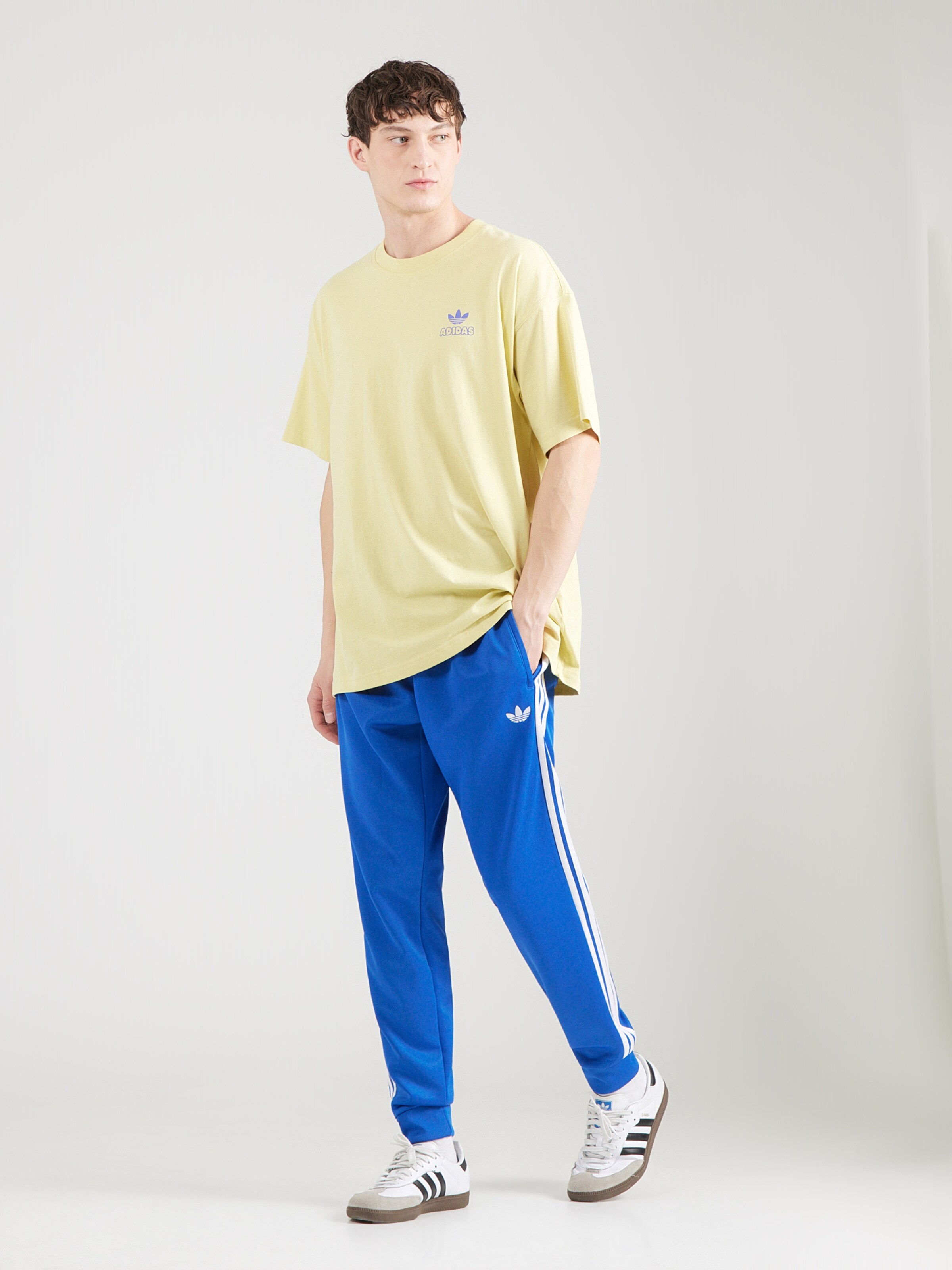 Adidas Originals Брюки с зауженным низом в синем цвете — фото 4