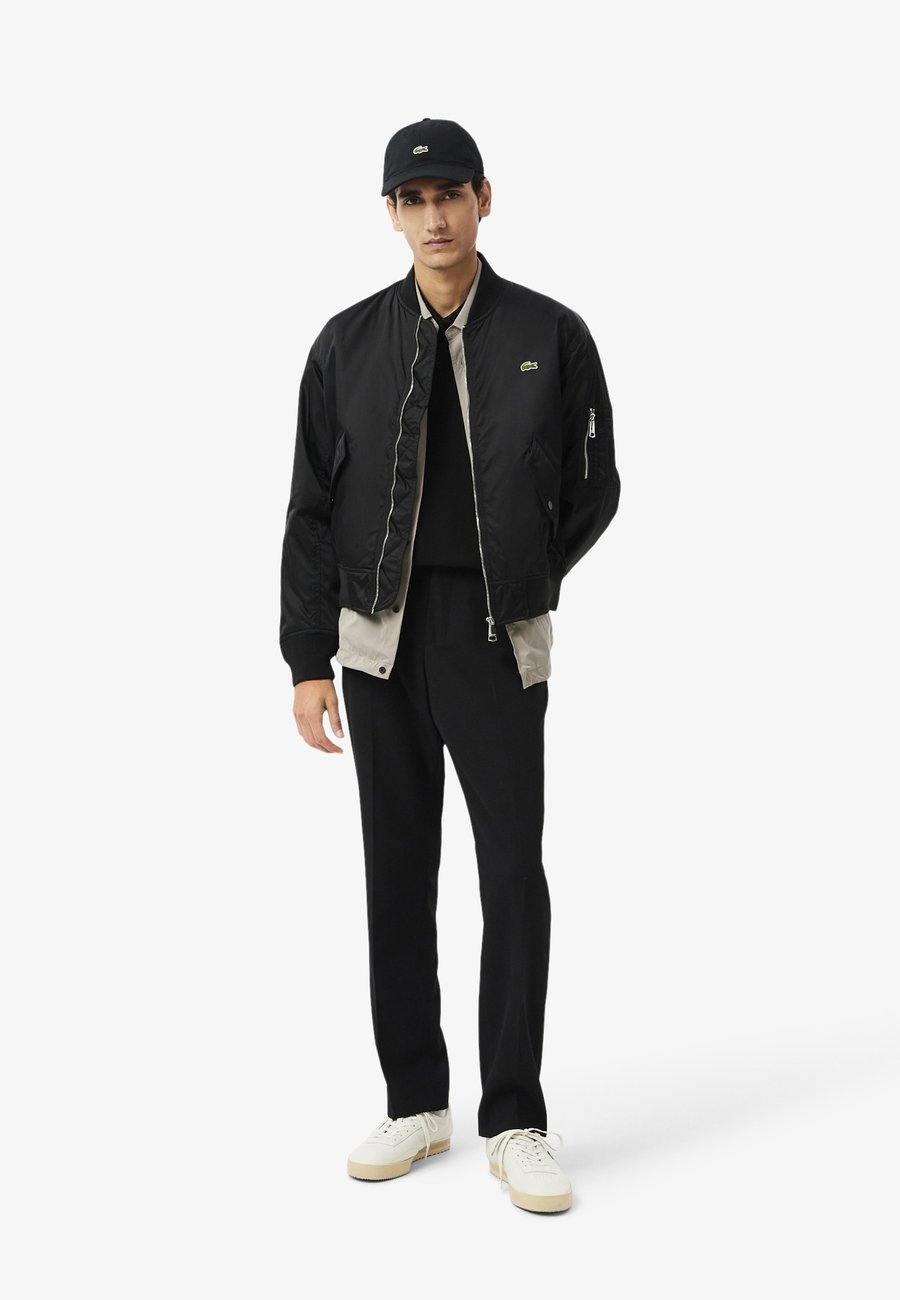 Поло Lacoste MC HOMME, однотонное, черное — фото 2