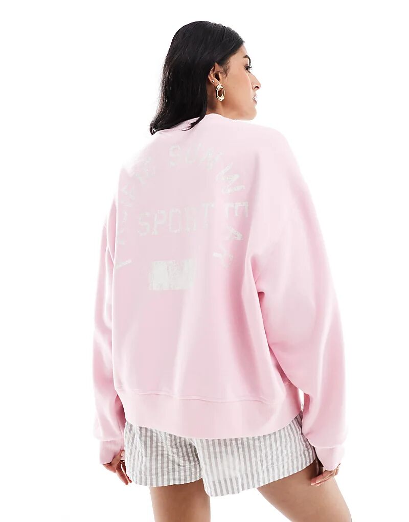

Розовый свитер с круглым вырезом со спортивным слоганом Pacsun