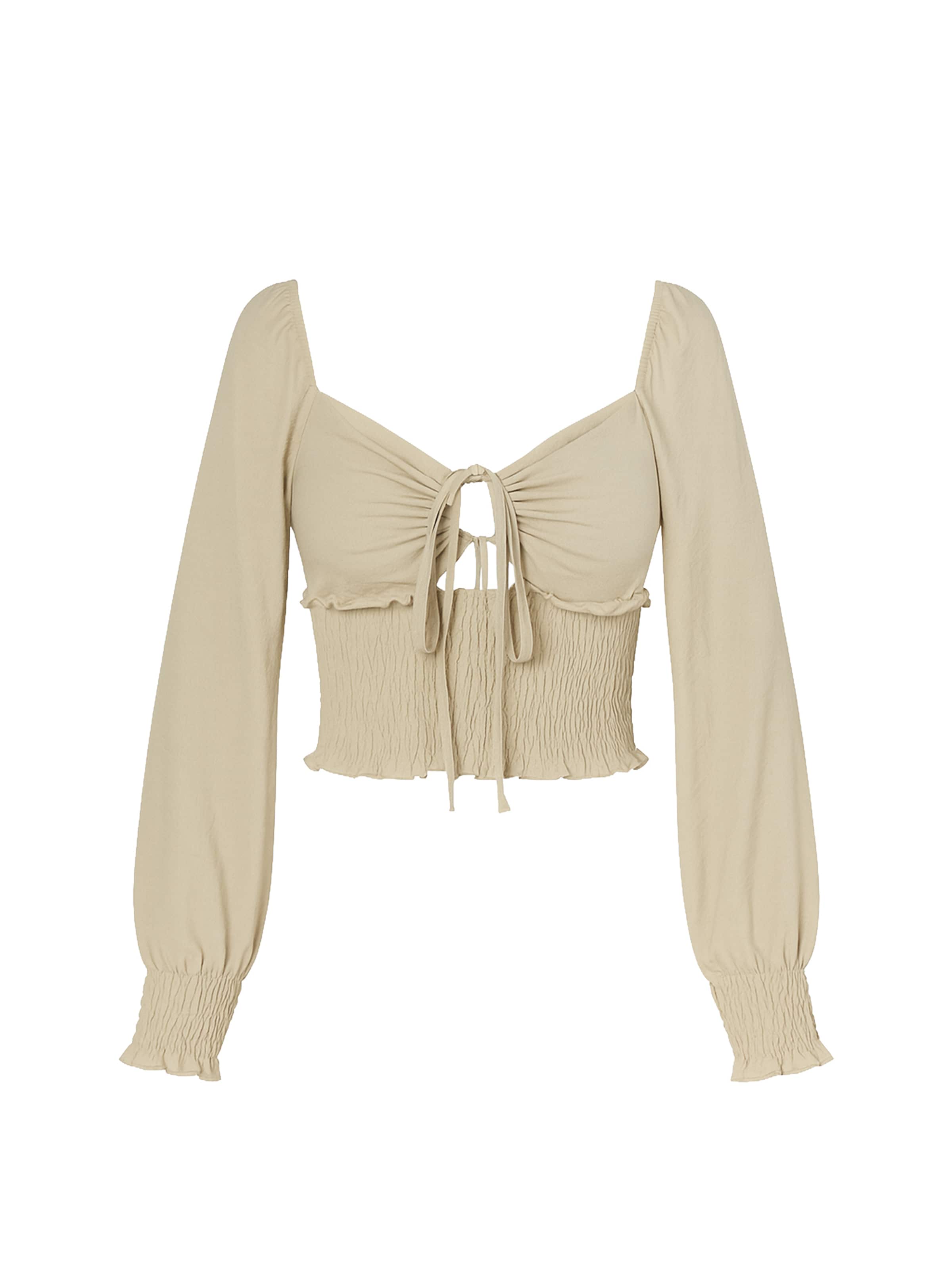 

Elara Блузка в бежевом цвете