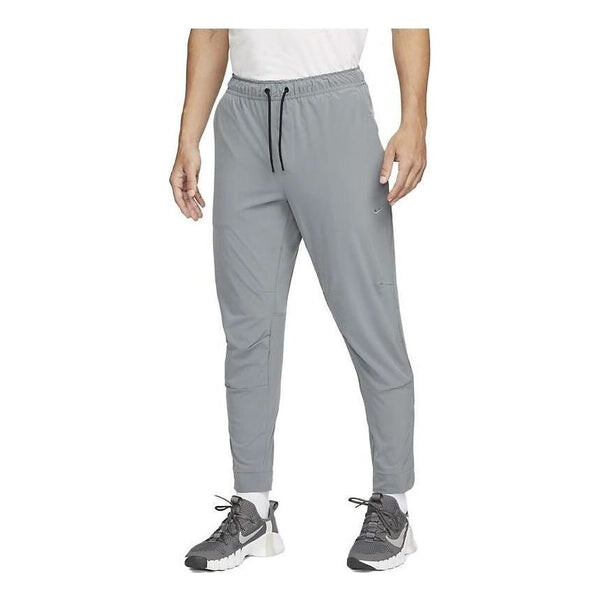 

Брюки dri fit с застежкой-молнией на манжете универсальные брюки Nike, серый