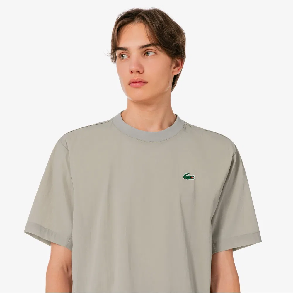 Мужская теннисная футболка-писте из тканого материала бежевого цвета от Lacoste — фото 2
