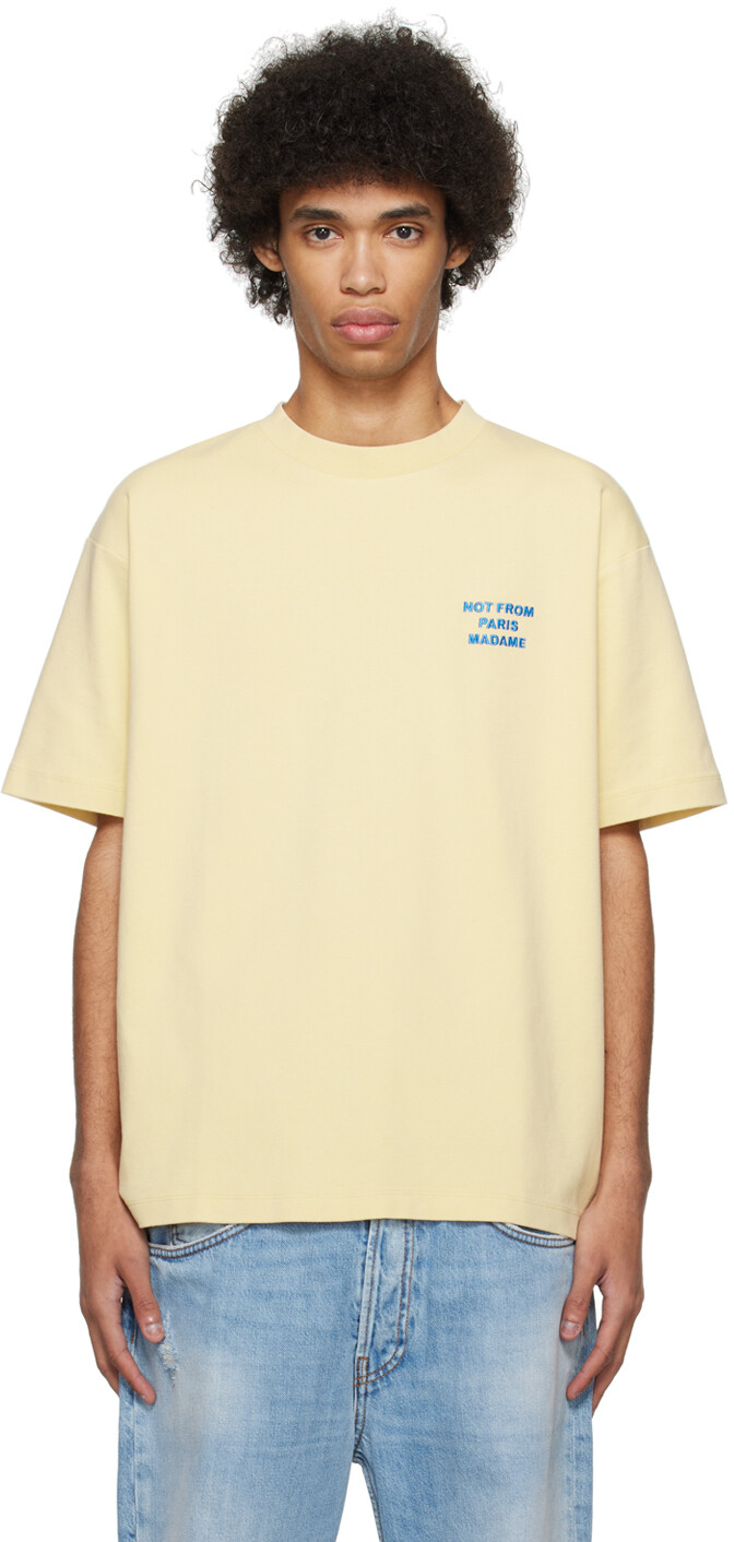 

Желтая футболка с надписью Le T-Shirt Drole De Monsieur