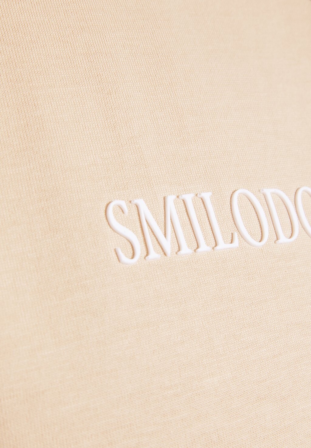 

Принт на футболке Smilodox, бежевый