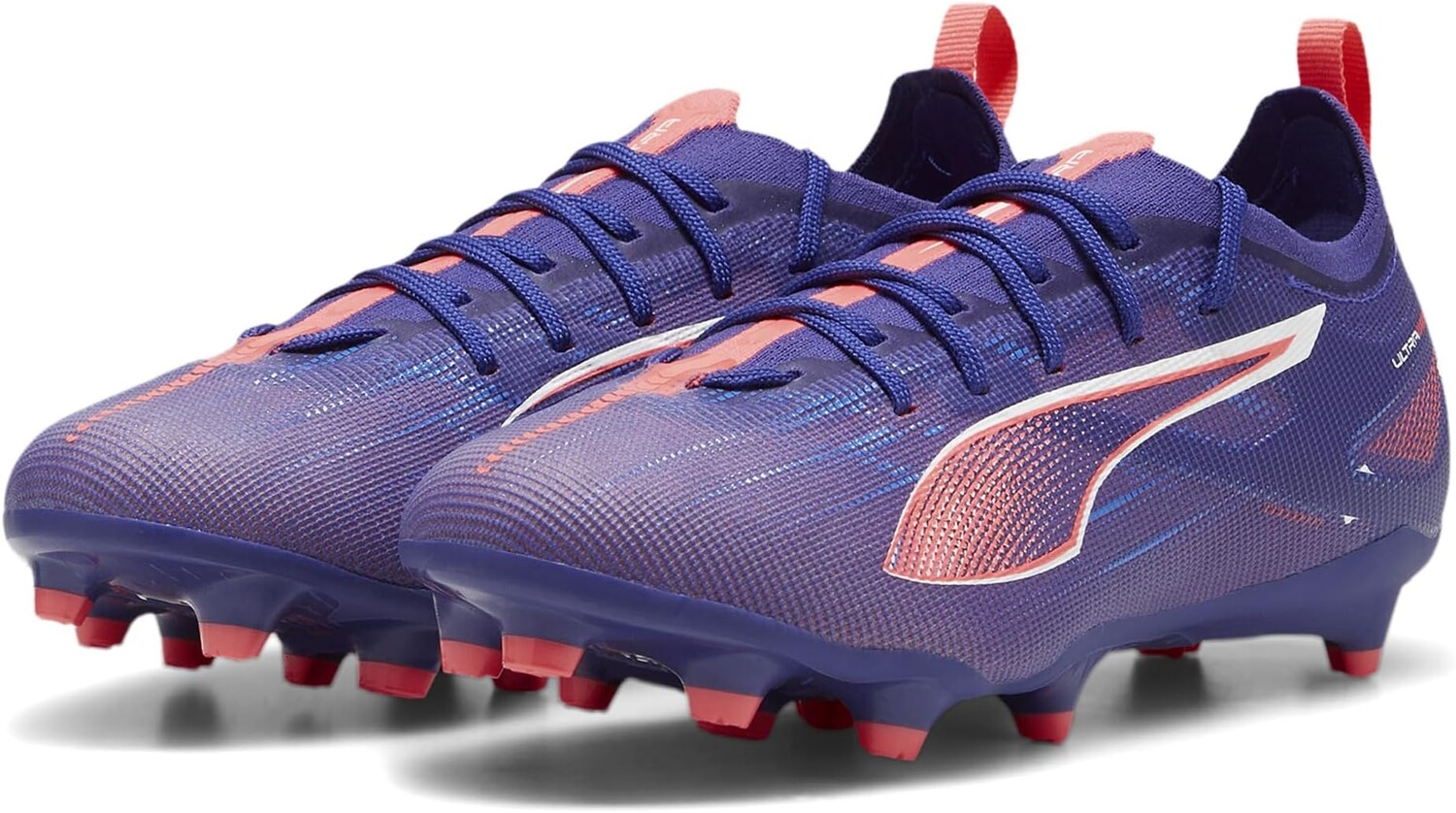 

Кроссовки PUMA Kids Ultra Pro Firm Artificial Ground, цвет Lapis Lazuli/PUMA White/Sunset Glow