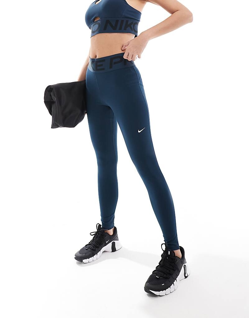 

Темно-синие корректирующие леггинсы с завышенной талией Nike Training Pro