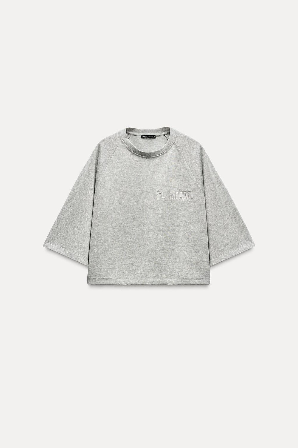 

Укороченная футболка с металлической нитью и слоганом ZARA, серебряный