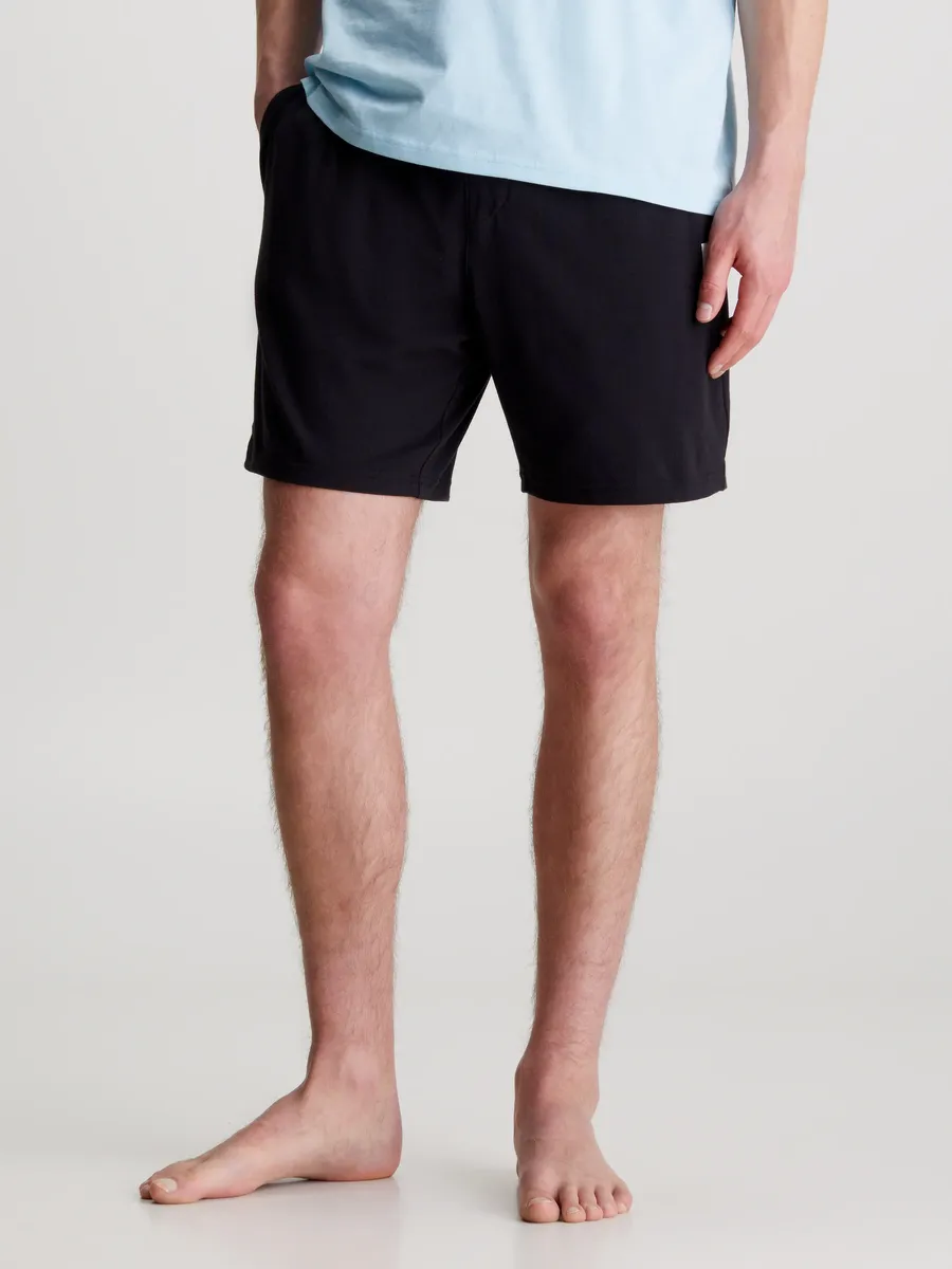 

Пижамные брюки Calvin Klein Underwear "SLEEP SHORT", с боковыми карманами, поясом на кулиске, значком с логотипом Calvin Klein, черный