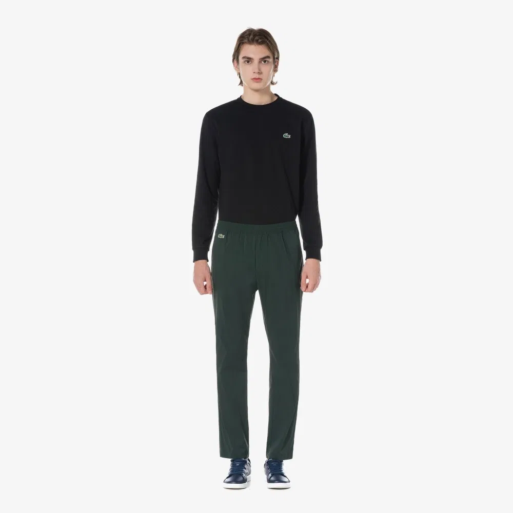 Мужские тканые базовые брюки глубокого зелёного цвета от Lacoste — фото 3