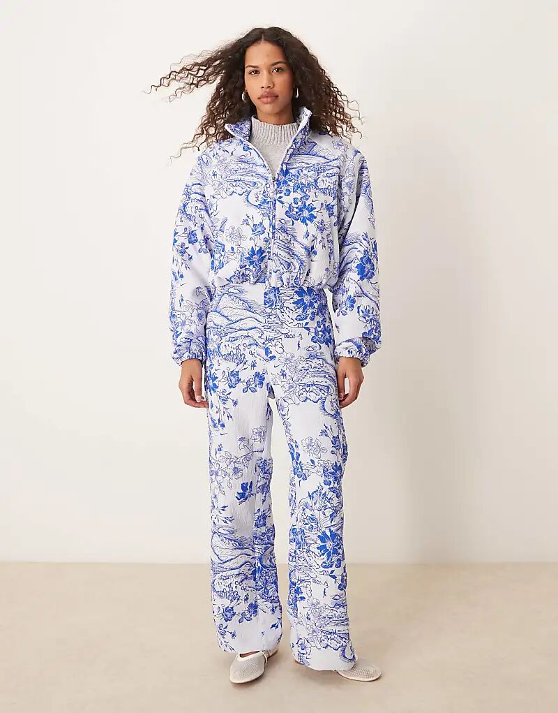 

Широкие брюки Nike MDC с жаккардовым цветочным принтом синего и белого цветов