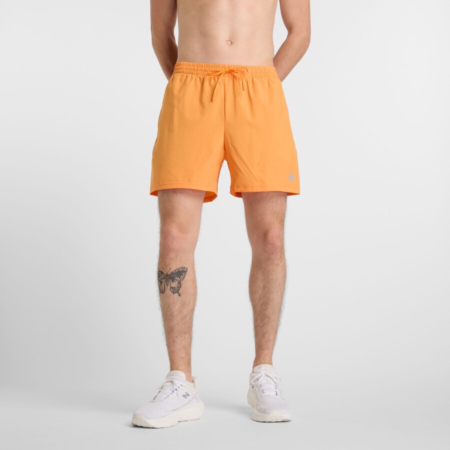 

Тренировочные брюки new balance Essentials, оранжевый