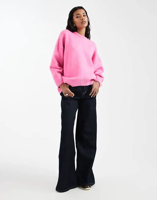 

Ярко-розовый свободный джемпер с круглым вырезом и закругленным краем ASOS DESIGN