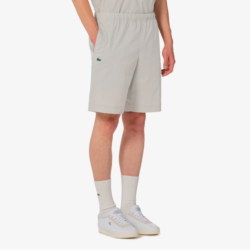 Мужские эластичные шорты из тканого материала бежевые от Lacoste — фото 2