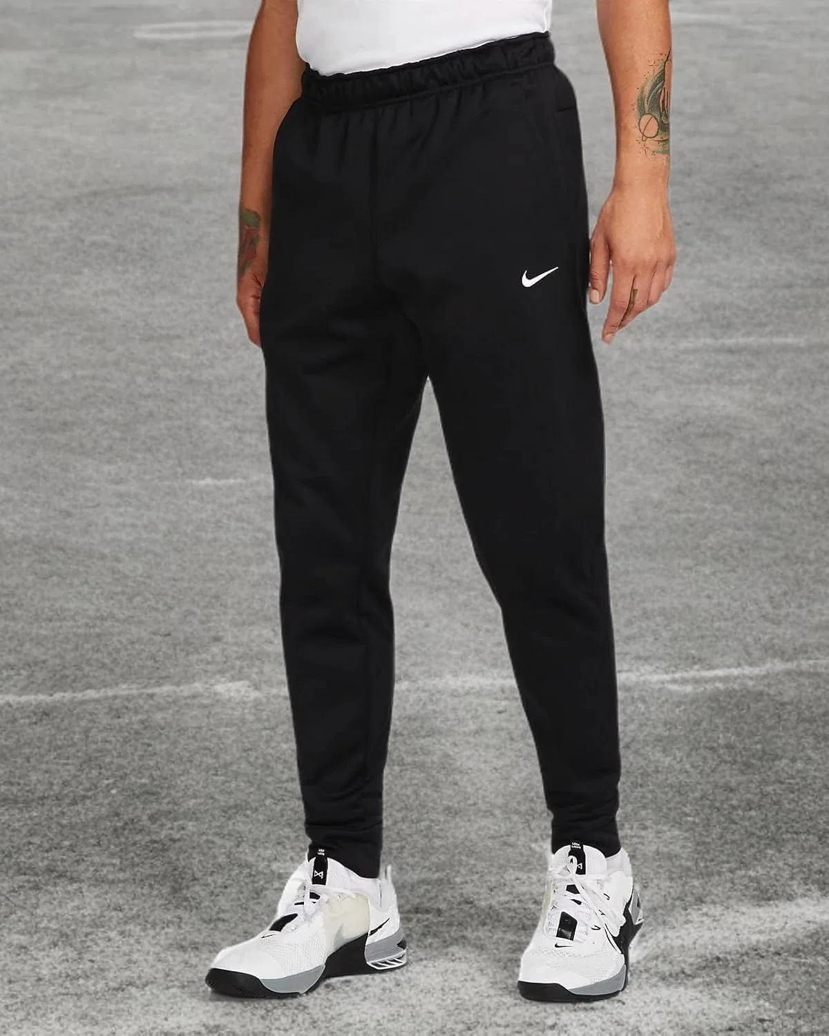 Мужские спортивные брюки Nike Therma-fit с зауженными штанинами — фото 4