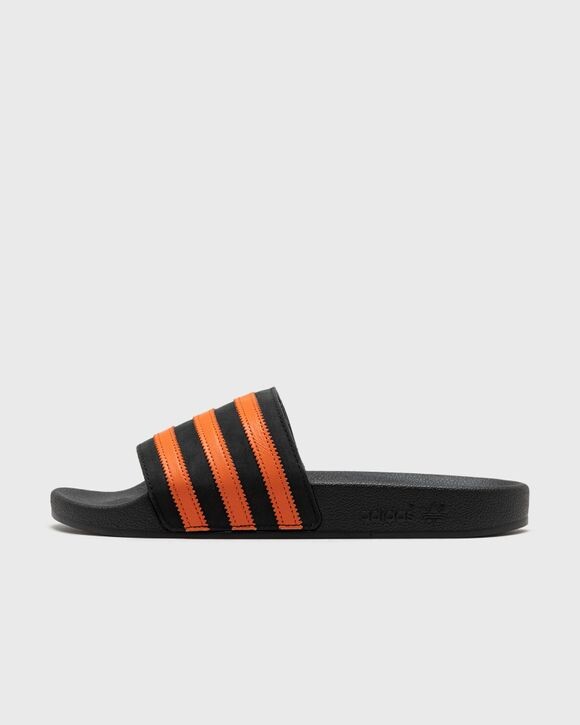 

Сандалии Adidas Adilette, цвет cblack/orange/cblack