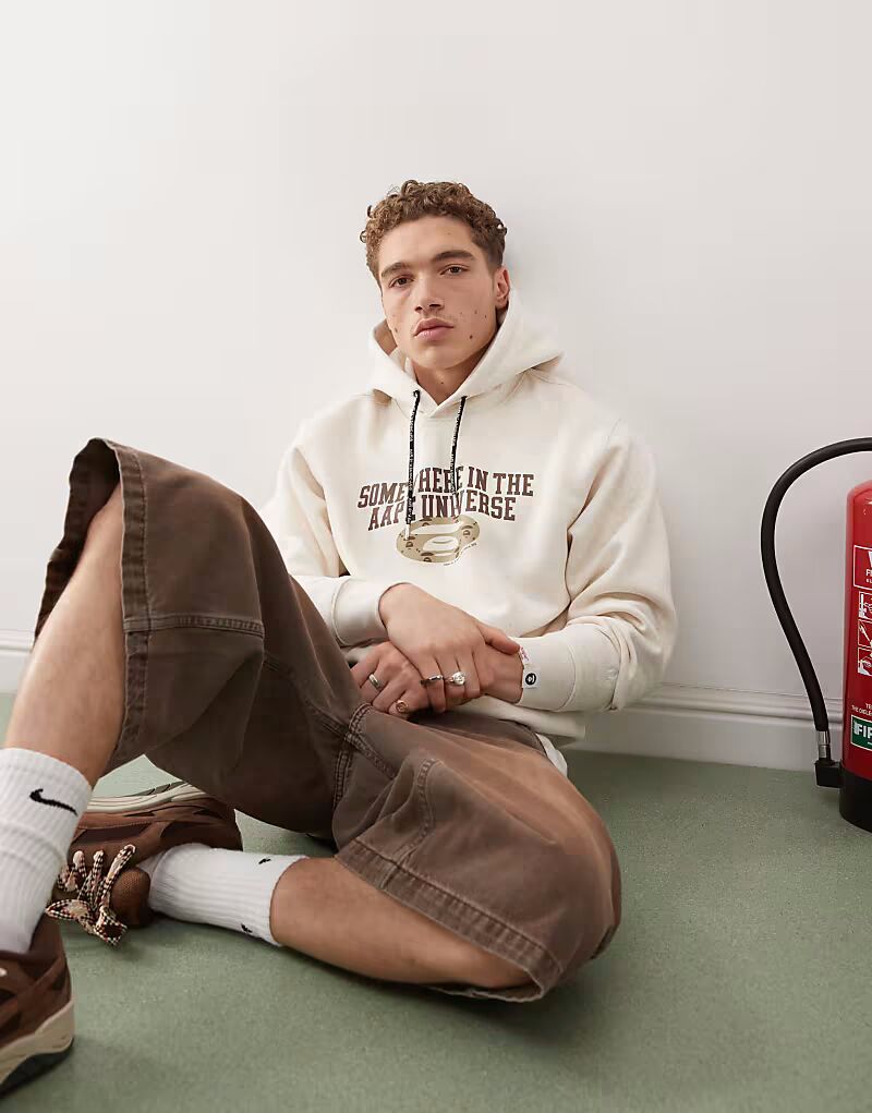 

Толстовка с логотипом Aape By A Bathing Ape и принтом на спине бежевого цвета