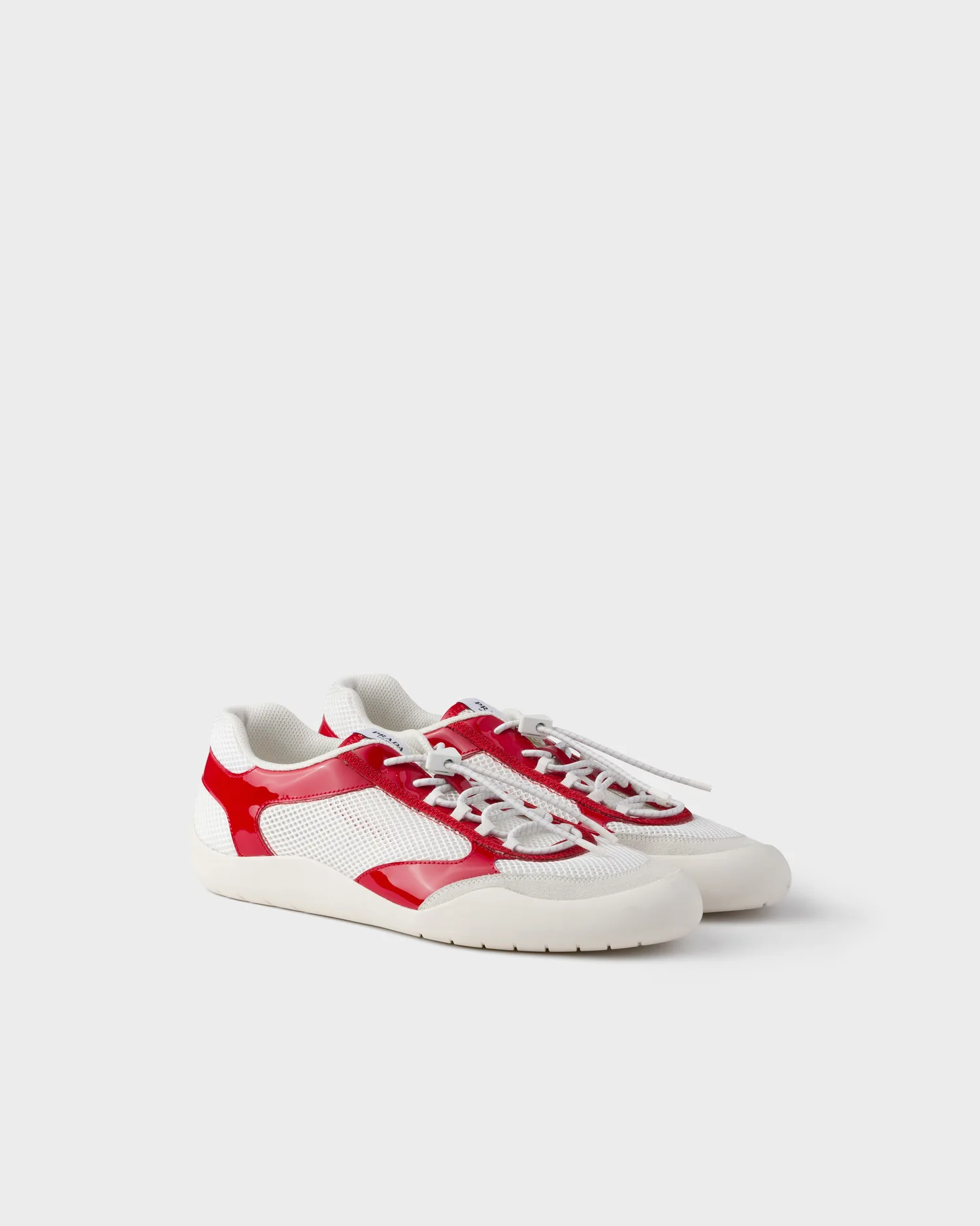 Кроссовки Speedrock из лакированной кожи и сетчатой ткани Prada, красный