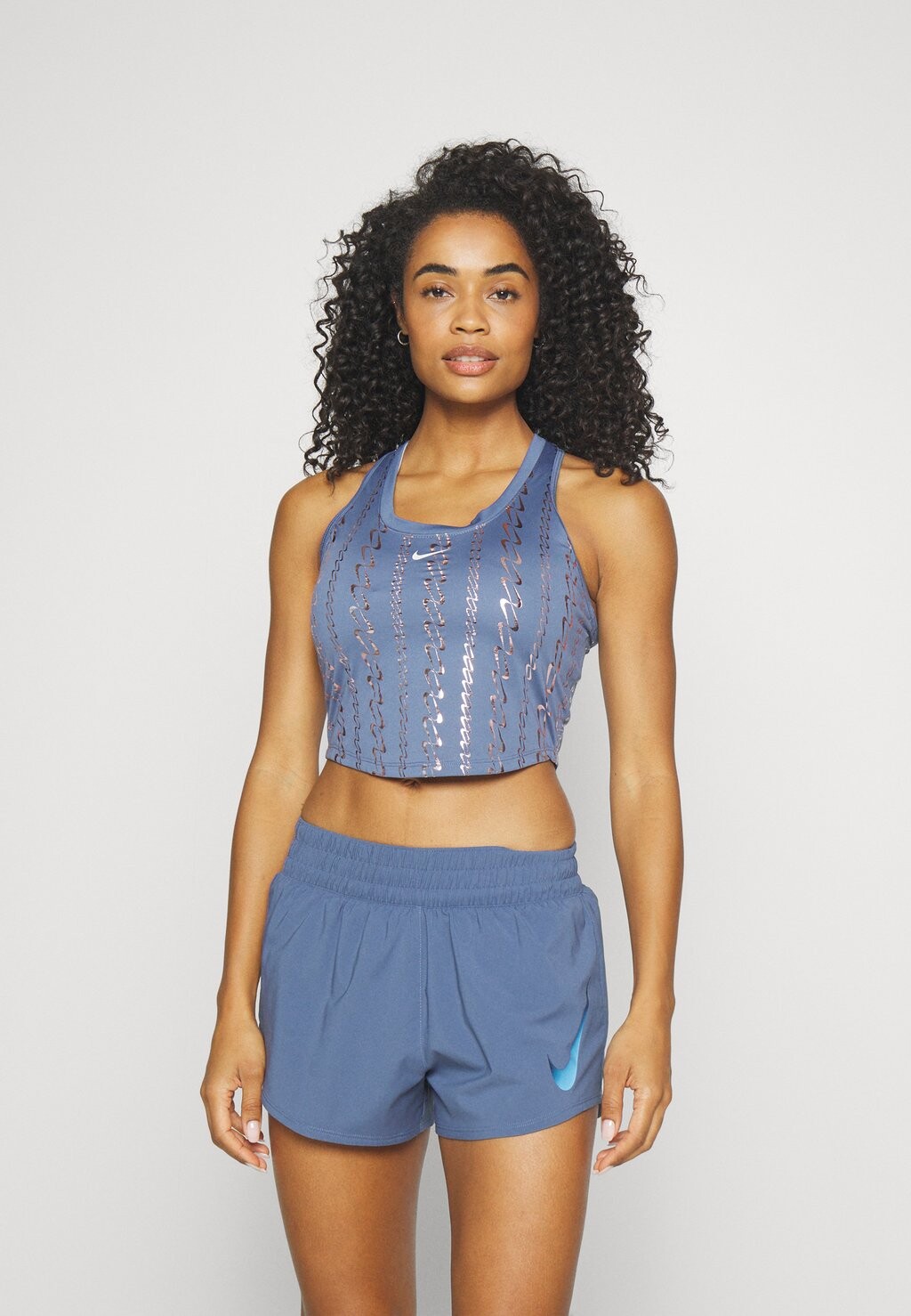 

Верх W NK ONE DF TANK AOP Nike, рассеянный синий