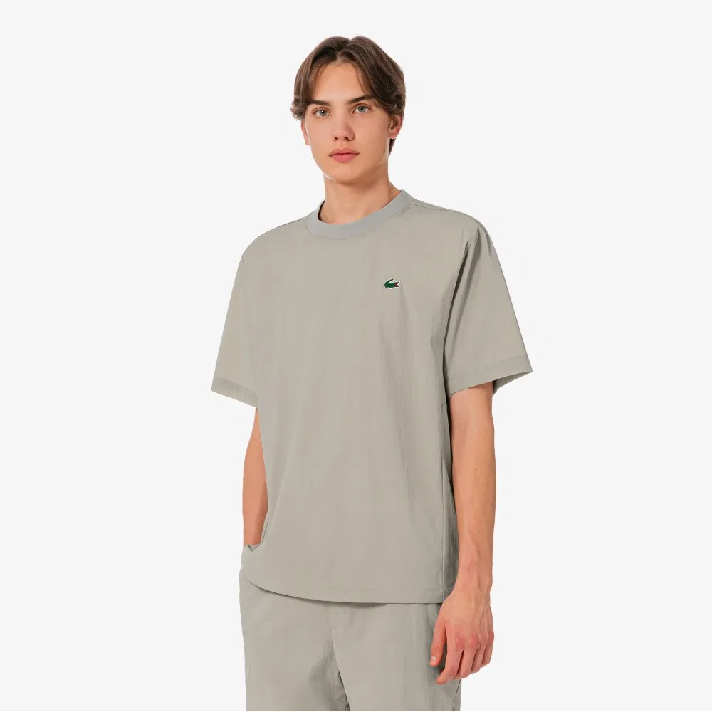 Мужская теннисная футболка-писте из тканого материала бежевого цвета от Lacoste