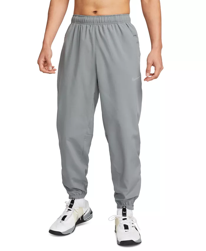 

Мужские тренировочные брюки Form Dri-FIT стандартной посадки с сужением к низу Nike, серый
