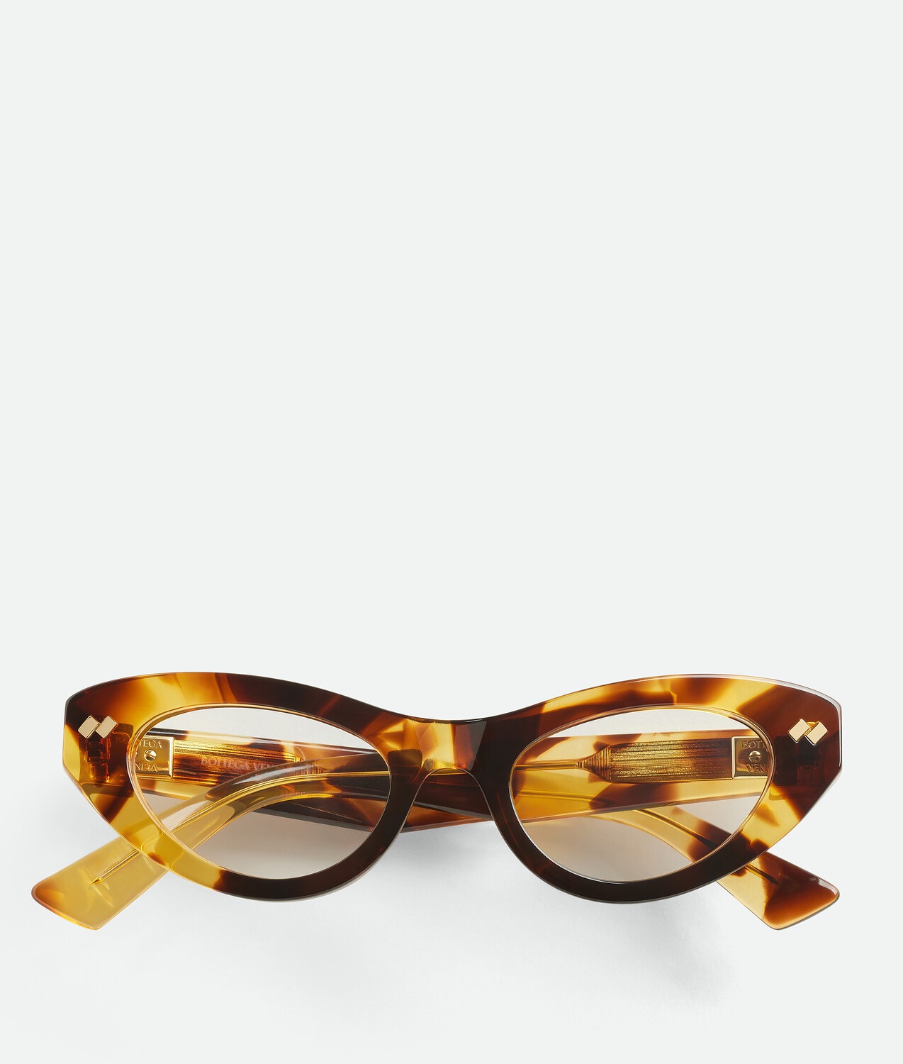 

Dizzy cat eye eyeglasses BOTTEGA VENETA, прозрачный/гавана