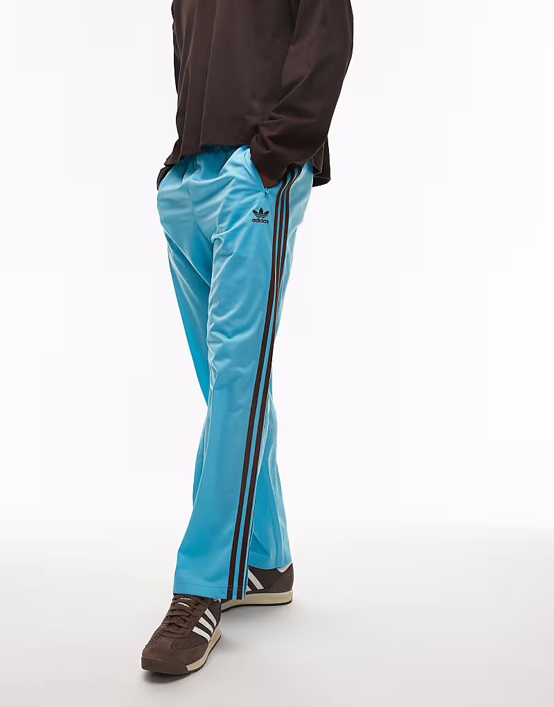 

Спортивные брюки Adidas Originals Firebird синего и коричневого цветов