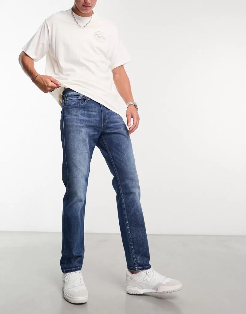 

Темно-синие зауженные джинсы Levi's 502