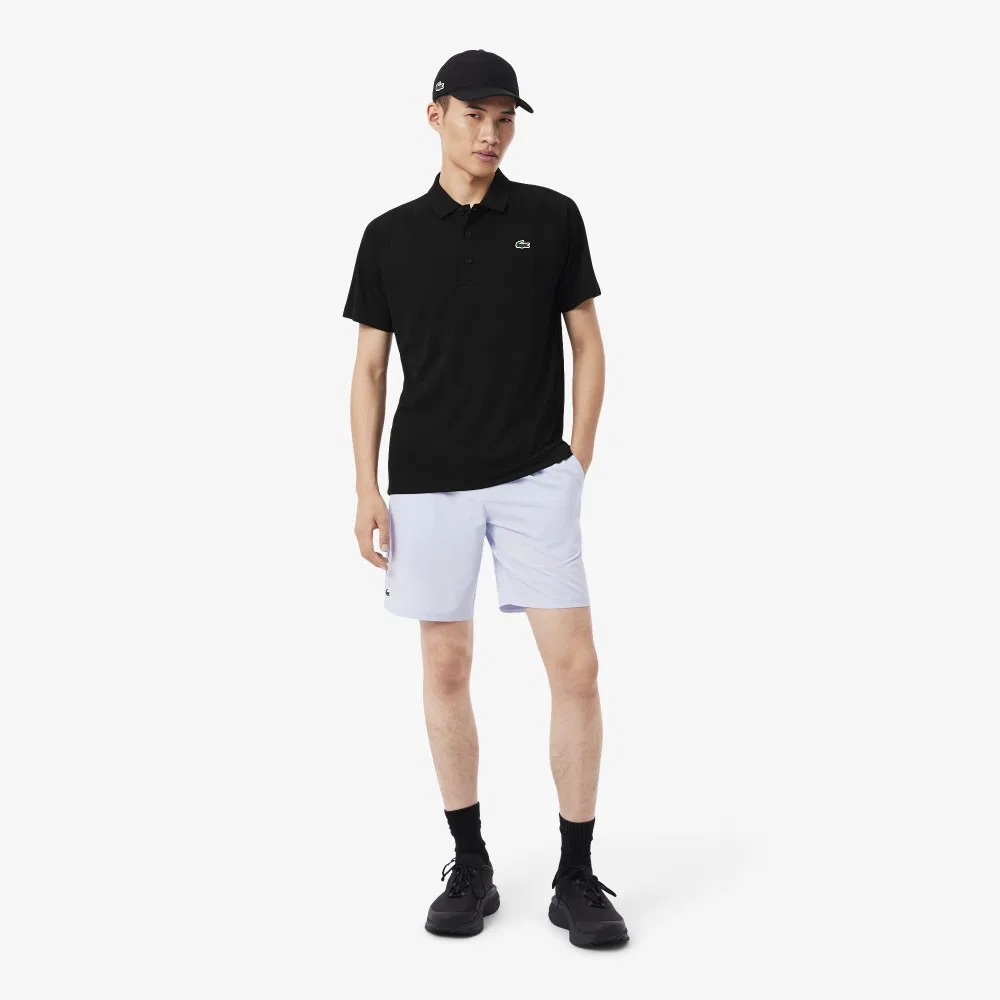Мужская чёрная базовая футболка-поло с рукавами реглан от Lacoste — фото 4