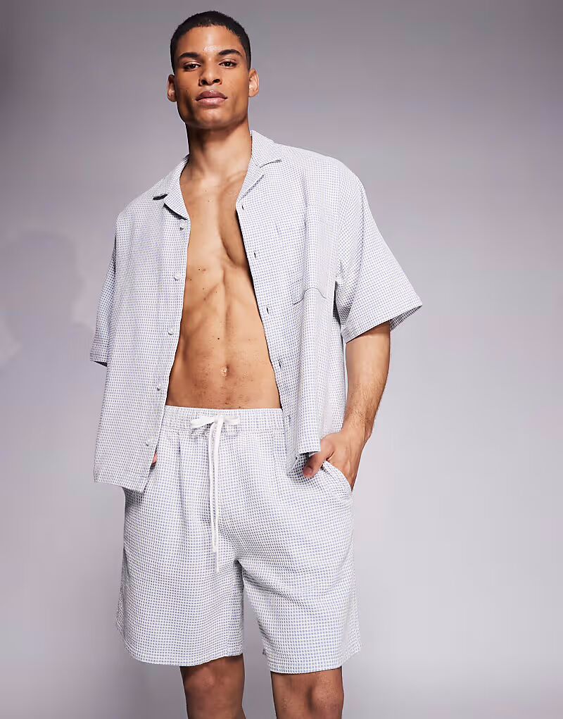 

Шорты средней длины из синей и белой вафельной ткани Asos Design