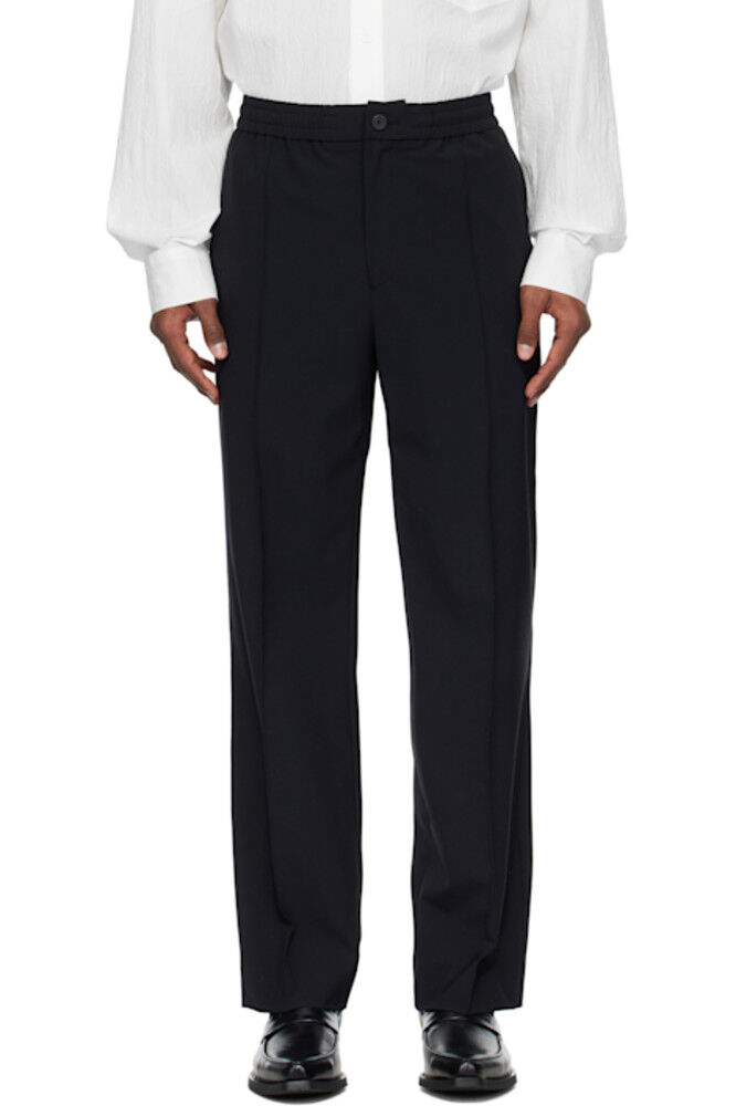 

Черные шерстяные брюки с защипами и окантовкой Solid Homme