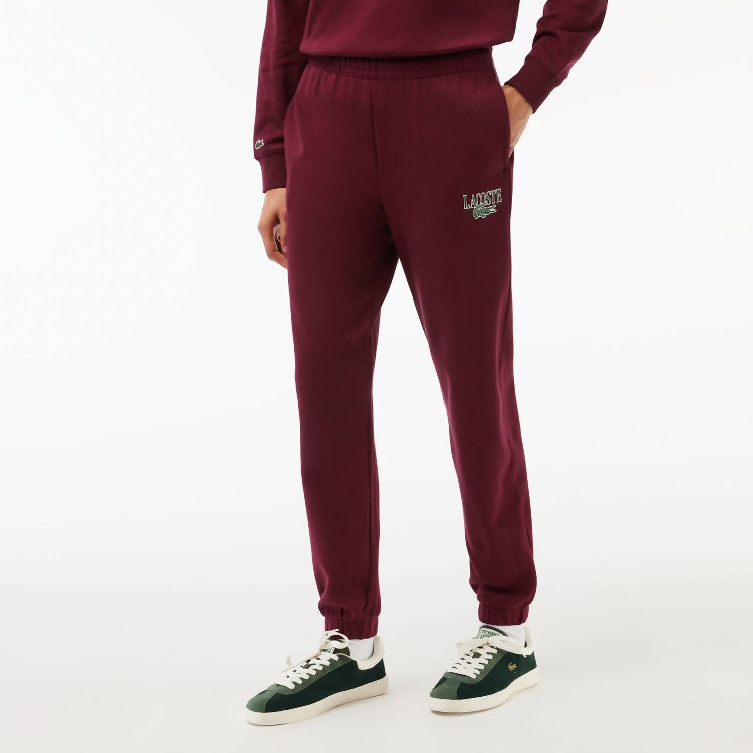 

Женские спортивные штаны с логотипом красного цвета Lacoste