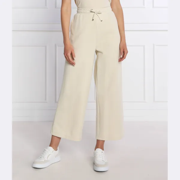 

Расклешенные спортивные брюки Calvin Klein, бежевый