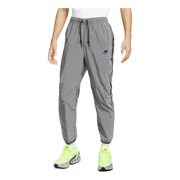 

Брюки tech woven flash pants asia sizing 'reflect silver black' Nike, серебряный
