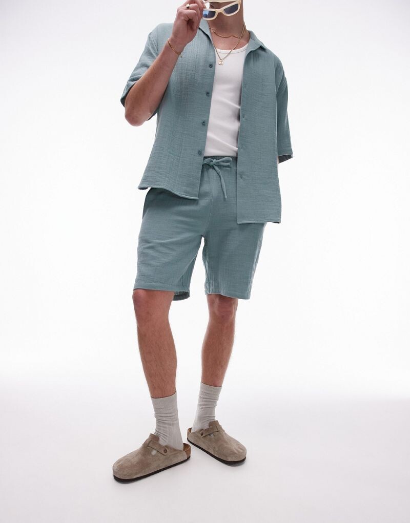 

Синие стираные шорты Topman