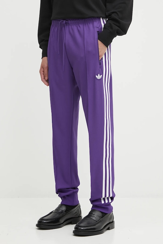 

Спортивные штаны REAL ICON TP Adidas Originals, фиолетовый